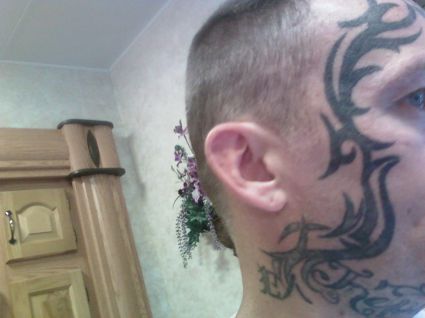 Tribal Tattoo Inked On Face